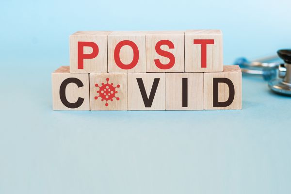 wooden blocks with letters that spell out "post covid"