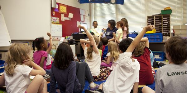 children in a classroom reading time