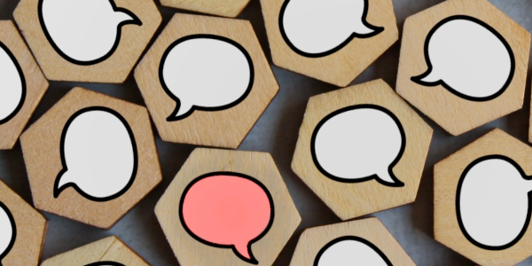 wooden blocks with speech bubbles