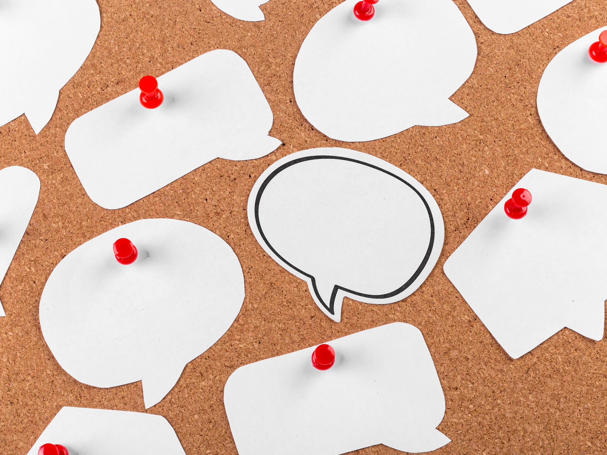 Cork board with several speech bubbles