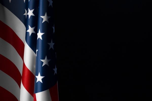 American flag hanging on a chalkboard