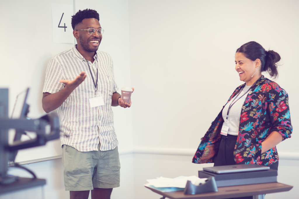 COMM members laughing during an icebreaker event