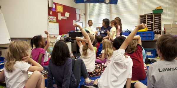 children in a classroom reading time