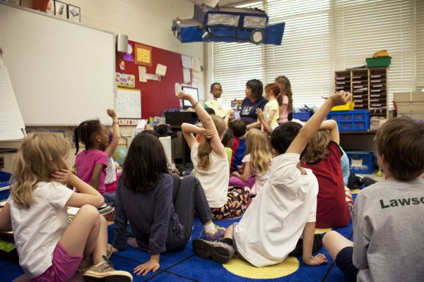children in a classroom reading time