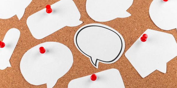 Cork board with several speech bubbles